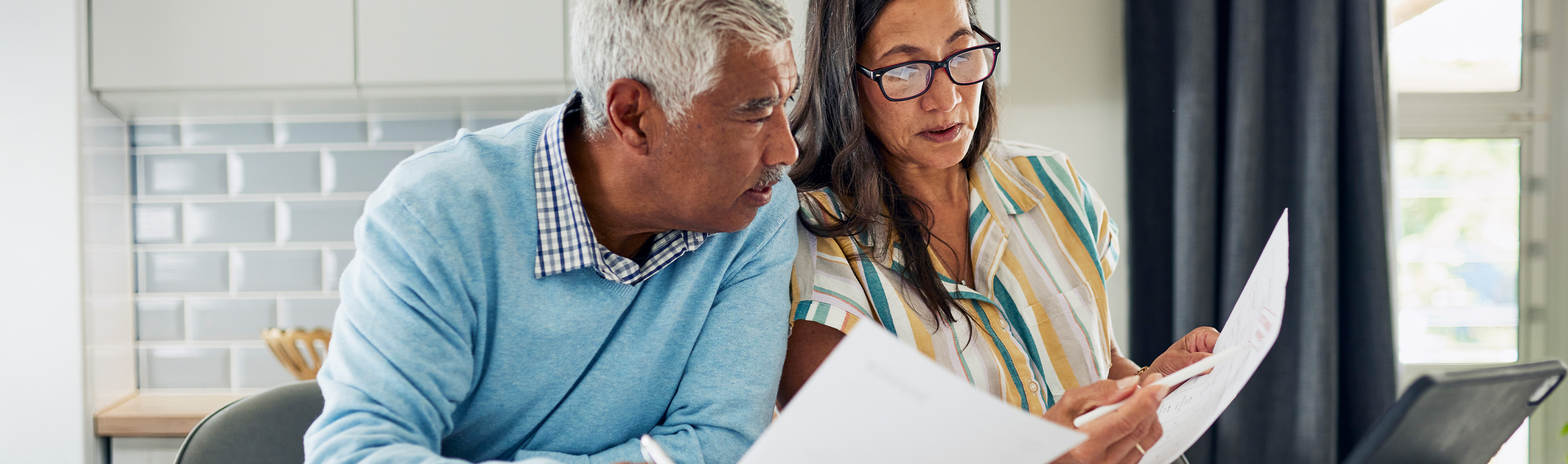 Man and woman looking at paperwork