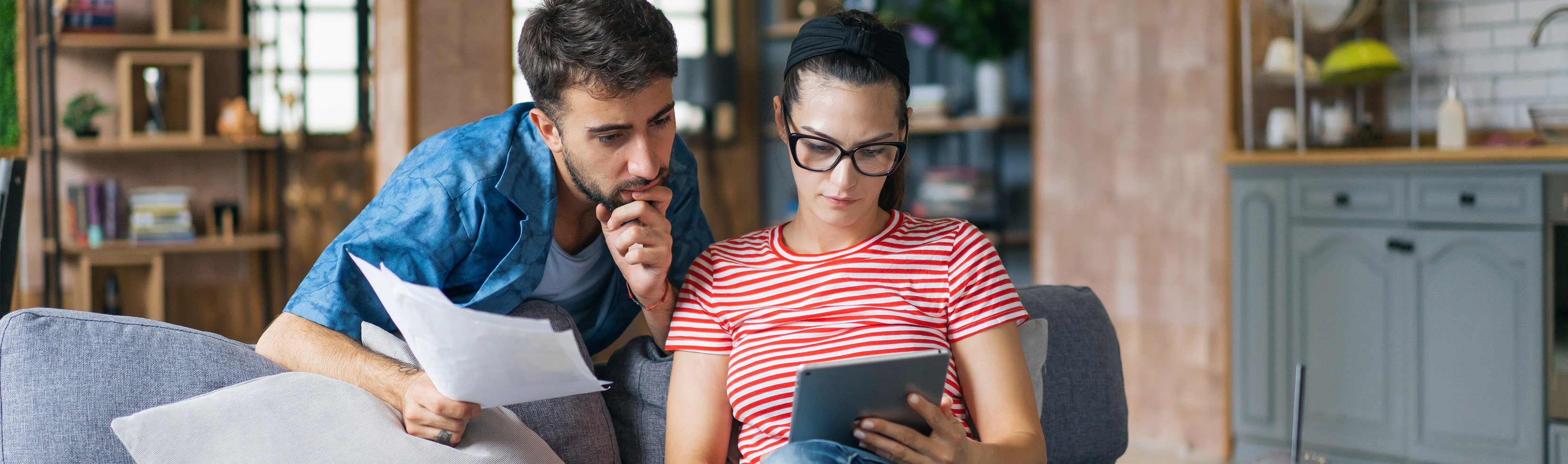 Man and woman looking at a tablet