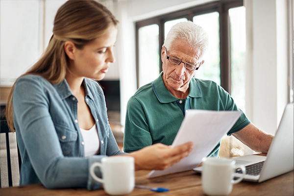 Man and woman looking at documents