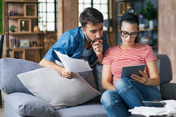 Man and woman looking at a tablet